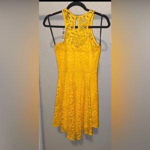 Yellow lace dress with a sweetheart cut size medium.